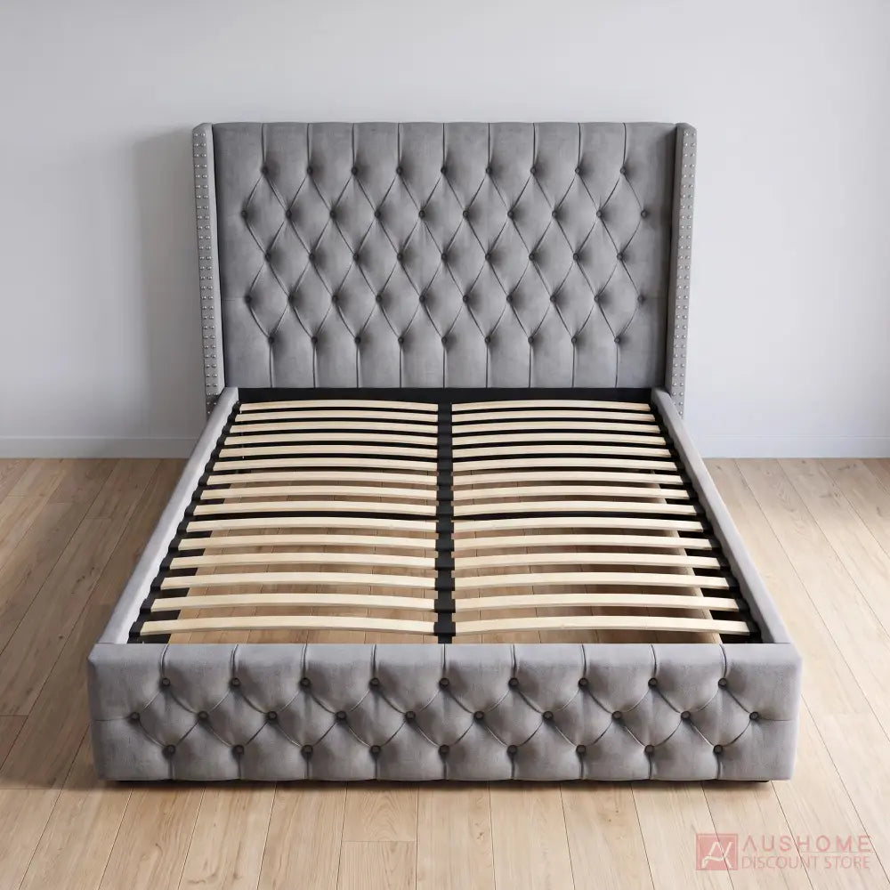 Grey fabric wingback gas lift storage bed with button-tufted headboard